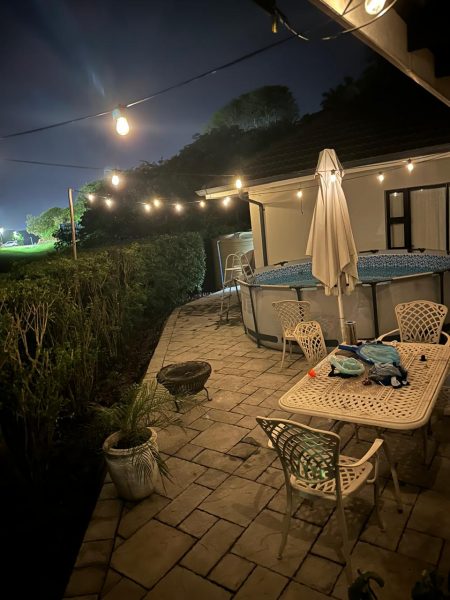 Photo of the outdoor living area at night in a private home in Ballito, Durban, South Africa