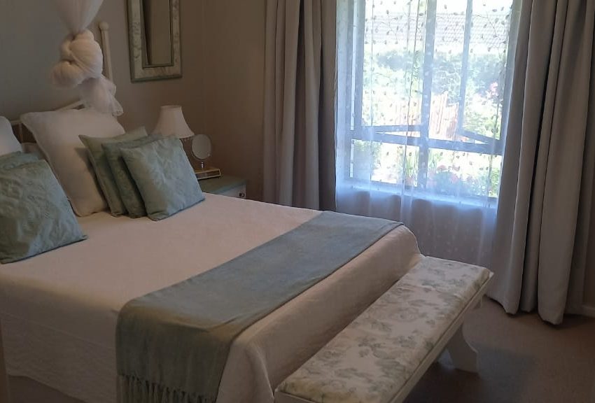 Bedroom with a view into the garden and the Tsitsikama mountain range beyond.