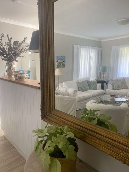 Photo of a lounge reflected in a mirror in a retirement cottage in South Africa | Copper Beech Place Homestory
