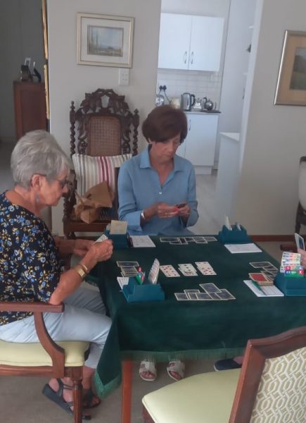 Playing bridge is a favourite pastime with friends.
