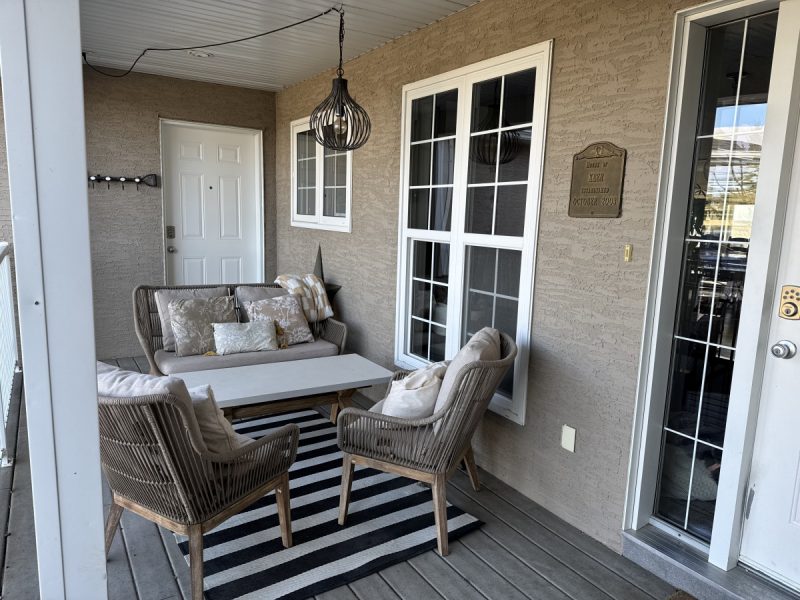 Sheltered front porch filters the light into the living area.