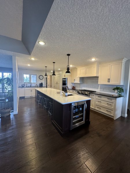 Open plan kitchen centred in the upstairs living space.