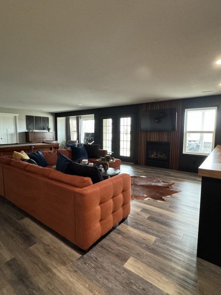 Entertainment area leads out into the backyard and the outdoor kitchen and fireplace.