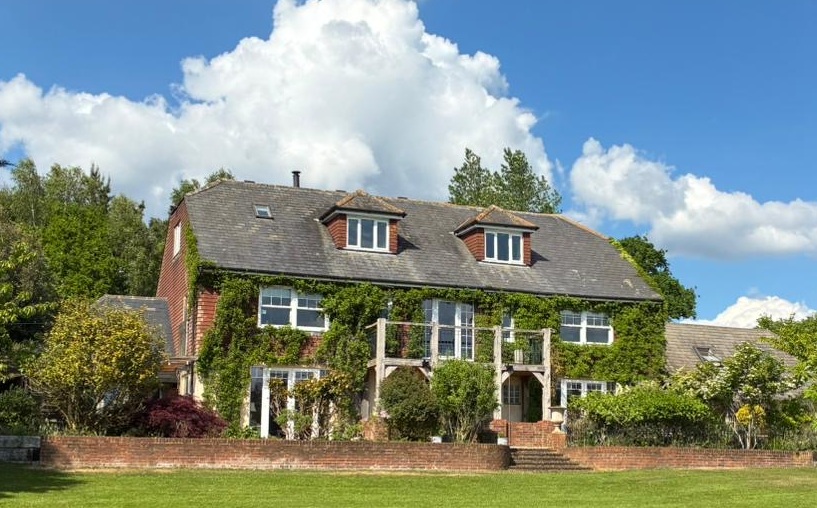 Photo of the green house facade in the summer months