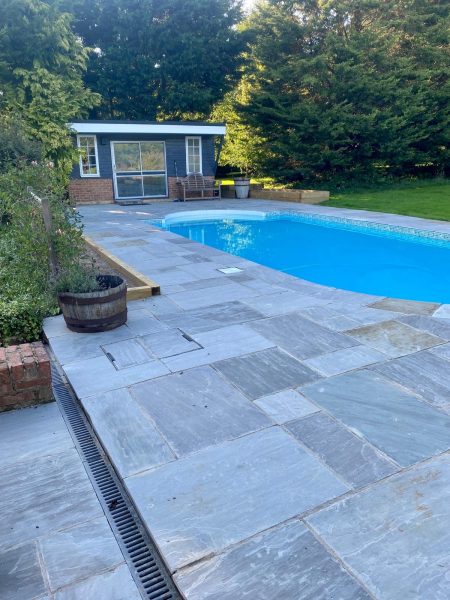 Photo of the pool area - freed from the claustrophobic looking roofed over enclosure and now embedded in the garden