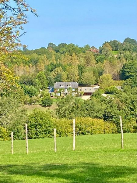 A photo showing the property in summer