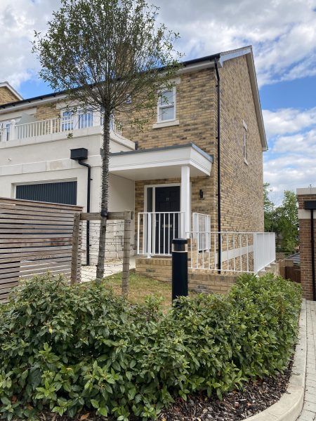Photo of the entrance of the semi-detatched house built on 3 levels.