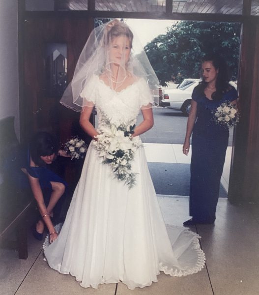 Photo of a bride and bridesmaid entering the church
