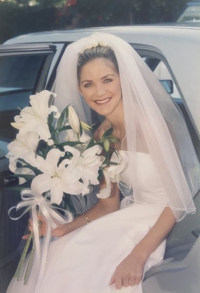 Photo of a bride getting into the bridal car