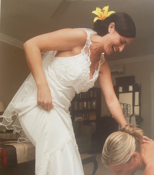 Photo of bride slipping into her bridal shoes