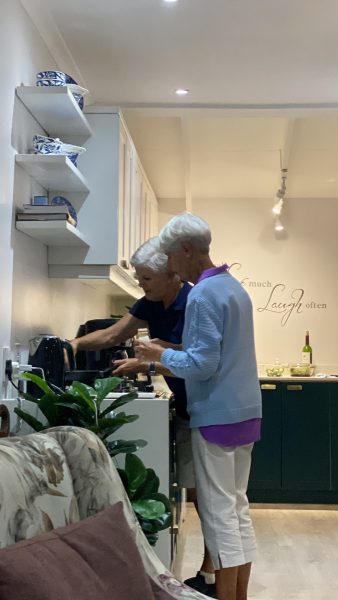 Photo of two women cooking in the kitchen