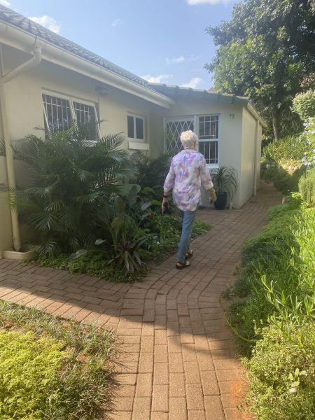 Photo of a woman walking down a path